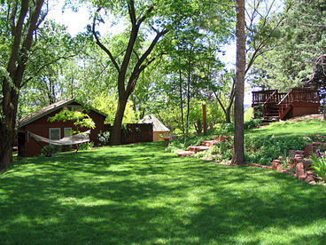 Green Lawns and Red Buttes surround the Lodge.  Swing in the Hammock and relax