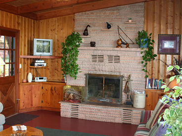 Homestead House  fireplace. Sit on cooler days and sip Hot chocolate by the fire.