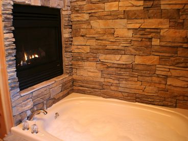 Enjoy a bubble bath and the fireplace in your stone enclosed two-person jacuzzi
