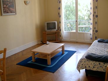 TV, Stereo, coffee table, double bed settee. Opens to balcony with tables and chairs, Ideal for watching the world go by as you relax  with a coffee or glass of local wine.