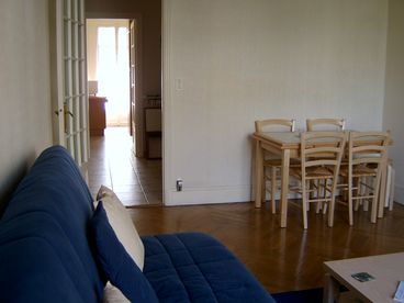 Extendable dining room table with 6 chairs. Leads to hall and kitchen