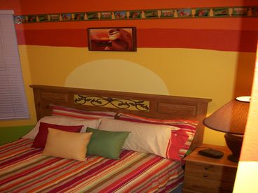 Lion King bedroom with a large closet, full size bed and cable TV