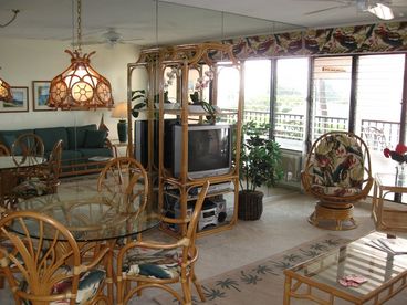 The fully mirrored living/dining room wall adds to the spacious feel and brings in ocean views when the windows are open.