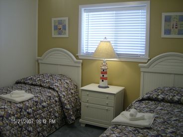 Guest bedroom with 2 twin beds.  Close to second bathroom.