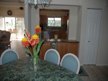 There is a pass thru from the kitchen to the dining room! Nice and airy with lots of room. Notice the utility closet to the right of the pass thru window.