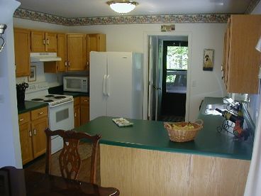 You will find everything you need in this cute kitchen.