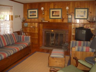 Living room with fireplace,television and pull out queen couch (television/dvd/vcr/stereo in enclosed sunroom)