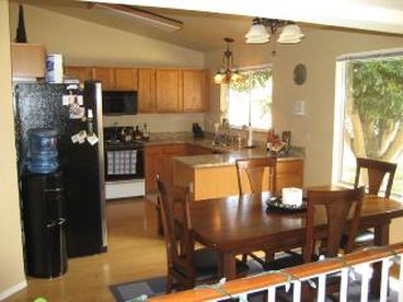 Beautiful kitchen! Gas stove, granite countertops, all the amenities you need! Ice make, Arrowhead bottled water on tap! We stock the kitchen FOR you!!!