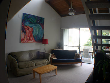 Spacious living room with a couch and a full futon for lots of space.  It can turn into a third bedroom.