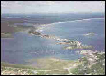 Hills Beach is the peninsula shown in the center of photograph and views of the shoreline of Cape Elizabeth, Scarborough, Old Orchard Beach, Saco and Biddeford Pool are all within sight from the living room of this home.