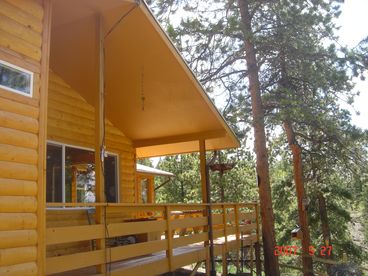 Side deck, opening to large deck with picnic table for outdoor dining and viewing of wildlife