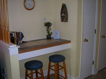 Counter area for dining, writing, or playing games.
