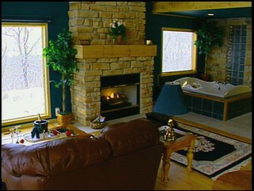 Inside of Chalet 5 has 23 foot ceilings and the waterfall by the 135 gallon whirlpool makes for a very romantic stay.  The deck faces south for you sun bathers.