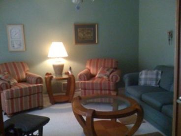 Living room with French doors for privacy.  Wireless Internet