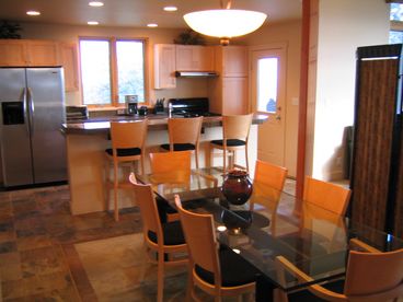Seating for 6 at the table, plus 3 at the counter bar.