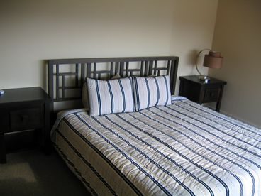 King size bed, TV, and full private bath with steam shower.