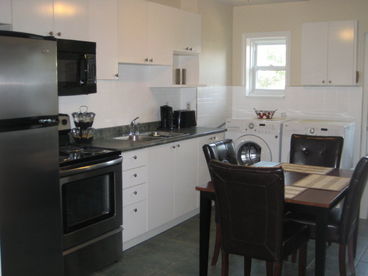 New stainless fridge & stove with front load washer and dryer