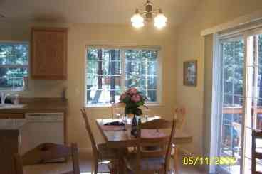 Dining room area with  table seating for 4-8 with added leaves