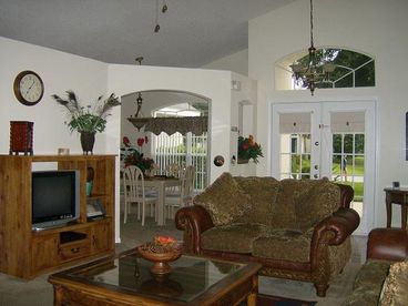 LOUNGE HAS LUXURY DESIGNER FURNISHINGS. CEILING FAN. FLAT SCREEN SATELITE TV. DVD PLAYER AND HI-FI SYSTEM. PATIO DOORS LEADING TO POOL.