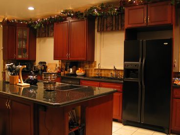Kitchen is very big. This photo only shows half of room. Has Jenn-air cooktop with grill, Double ovens, dishwasher. All the amenities of a gourmet kitchen to prepare fine family meals.