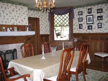 Seating for 8. Gas log fireplace sets the mood for enjoying the delicious meal prepared in the gourmet kitchen.