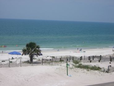 Beach view from deck - directly in front.  High table and chair set maximizes view over railing.   