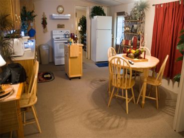Cozy Dining area with extending table.  Free local and domestic long-distance calling makes calling home or checking email easy, so don\'t forget the laptop!