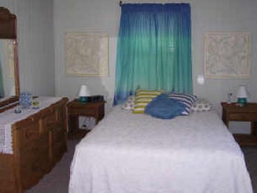 The master bedroom has a queen size bed with a new cozy mattress.