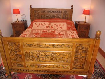 The bedroom with stunning hand carved furniture.