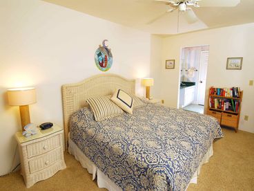 King sized bed with adjoining bathroom, opens up to the lanai