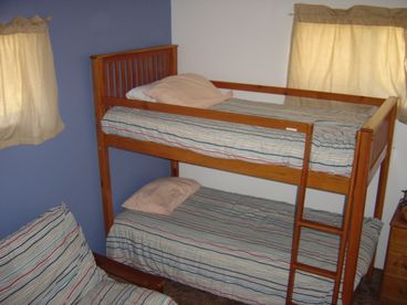 Blue room, queen futon, bunk bed, single bed.