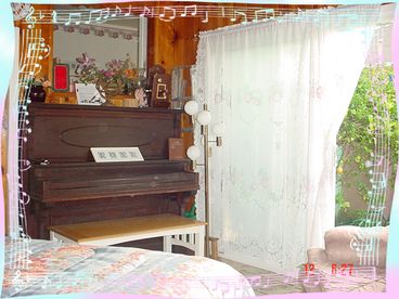 Family room, piano and lemon bush view.