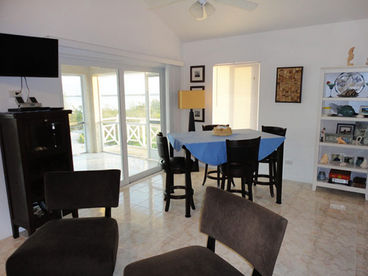 Dining room upstairs - visit our website to view downstairs dining room at bahamasbeachfrontvilla dot com