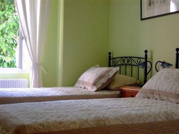 Twin beds overlooking the orange blossoms