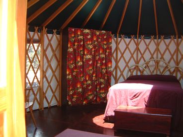 Tastefully decorated with closet, chairs, full sized bed, skylight, & fan.