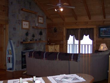 Comfy Den and wood burning fireplace in  your Pigeon Forge Cabin Rental