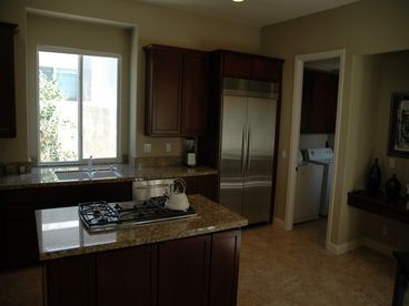 Kitchen with 2 convection ovens large refrigerator,microwave, 5 burner professional stove top and dishwasher
