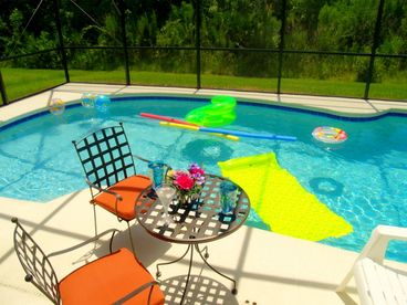 Screened-in, south-facing pool, backs to woodland.  Gas grill BBQ by the pool.