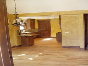 Front door looking in over dining and kitchen  this is brand new so the furnitures not in yet