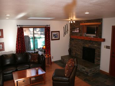 Large custom stone hearth with toasty gas fireplace 