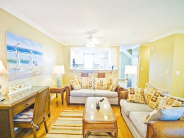 Our beautiful living room has a LCD TV and views of the ocean