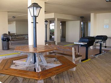 Barbecue area for your beach party adventure. (4 gas grills and 7 tables) 