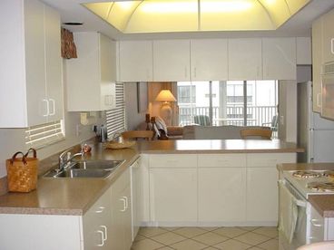 Well equipped with service for twelve. Dishwasher, disposal, icemaker, micro, blender and coffee maker.