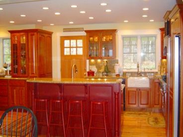 Gourmet kitchen with six burner Viking gas stove, wine cooler, granite counter tops