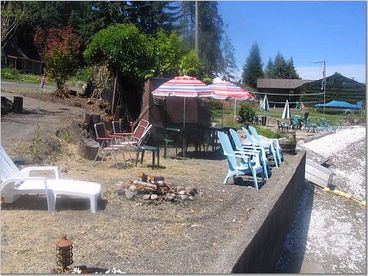 Your bulkhead with steps to beach and a firepit!  Enjoy the lawn furniture!