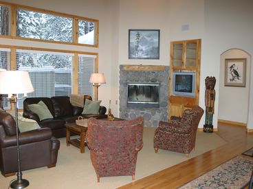 Great room with soaring ceilings features new lodge furnishings, exceptional sound system has an underfloor subwoofer that makes the room 'rock'.  Fun!