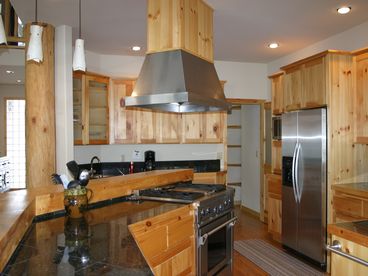 Oversized Sunriver Kitchen features open design with 3 prep areas, double sinks and dishwashers, new commerical appliances, granite counters, walk through pantry for great storage