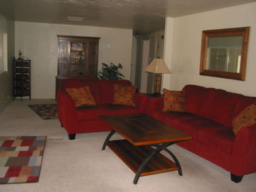 View of living room and hallway leading to the two bedrooms.