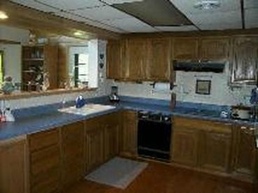 This nice spacious kitchen joins the living room.  The dining room has a wonderful view of the lake.