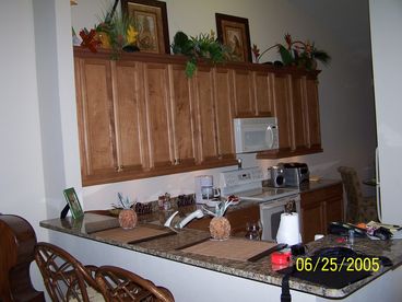 Kitchen has upgraded 42 inch Maple Cabinets and Granite Counter tops.